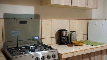 Fridge, microwave, stovetop, coffee/tea maker