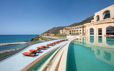 2 indoor pools, outdoor pool, open 8:00 AM to 7:00 PM, pool umbrellas. Royal Tulip Korbous Bay Thalasso & Springs