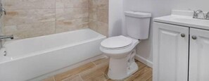 Combined shower/tub, hair dryer, towels, soap