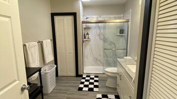 Shower, towels, soap, toilet paper