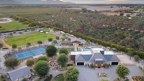 A large estate with multiple buildings, a tennis court, and a landscaped garden. - 8bdr Villa Tennis/pickleball, Golf Green, Pool House, Gym, Bar Mesquite38 (Thermal)