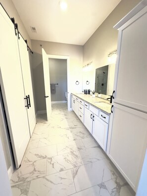 Combined shower/tub, hair dryer, towels, soap