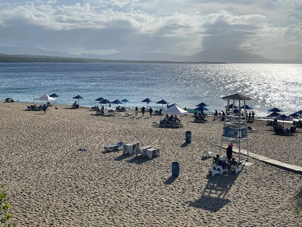 On the beach, sun loungers, beach towels