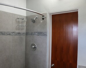 Shower, hair dryer, towels, toilet paper