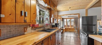 Walkable to downtown! Swing and overlook of the pines!