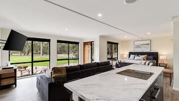 Deluxe Studio Suite, Non Smoking, River View | Desk, blackout curtains, soundproofing, iron/ironing board