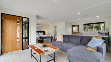 Deluxe Studio Suite, Non Smoking, River View | Living area | 55-inch flat-screen TV with premium channels, TV