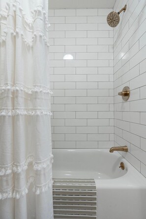 Combined shower/tub, hair dryer, towels, soap