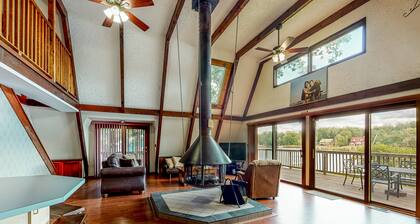 Waterfront home with wraparound deck, floating fireplace, deck, & firepit