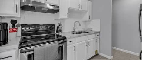 Fridge, coffee/tea maker, cookware/dishes/utensils