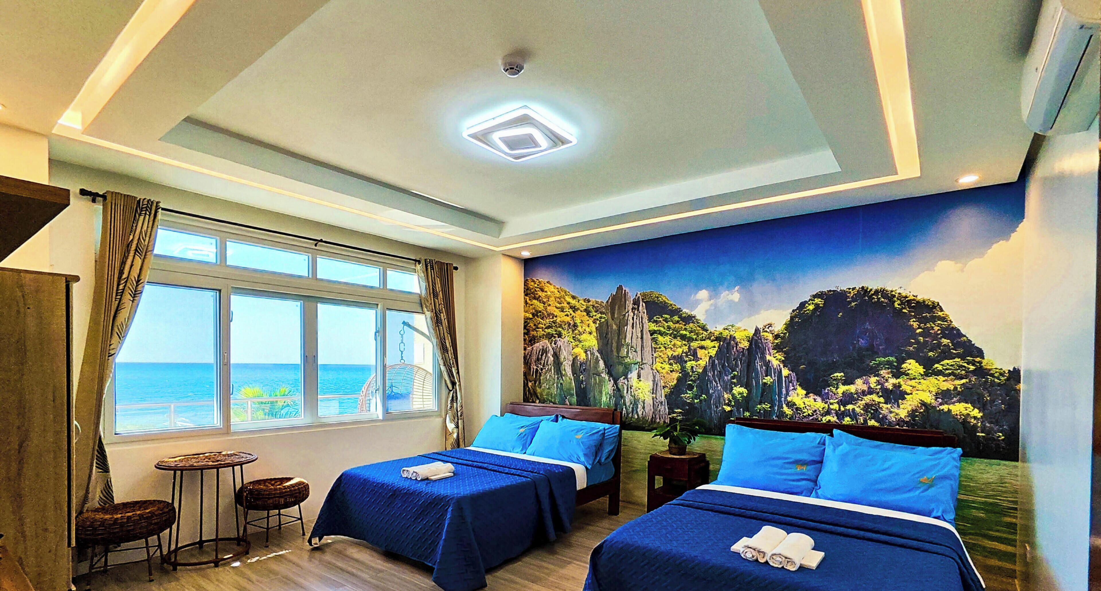 Chambre quadruple Deluxe, 2 lits doubles, climatisation, vue sur la mer | Décor unique, système d’insonorisation, accès au Wi-Fi (inclus)