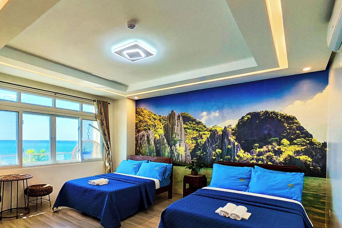 Chambre quadruple Deluxe, 2 lits doubles, climatisation, vue sur la mer | DĂ©cor unique, systĂšme dâinsonorisation, accĂšs au Wi-Fi (inclus)