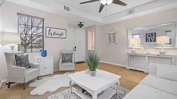 Smart TV, fireplace, books, printers
