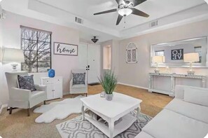 Smart TV, fireplace, books, printers