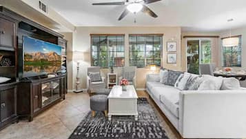 Smart TV, fireplace, books, printers