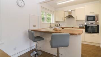 Fridge, electric kettle, toaster, cookware/dishes/utensils