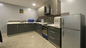 Deluxe Apartment | Private kitchen - Lovely 3-Bedroom Apartment (Kigali)