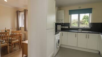 Fridge, electric kettle, toaster, cookware/dishes/utensils