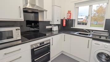 Fridge, electric kettle, toaster, cookware/dishes/utensils