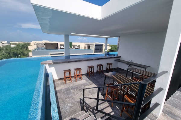 pool-sky-view-table-bar-chairs-cocktail-room-outside-common-area