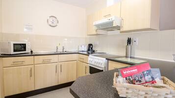 Fridge, electric kettle, toaster, cookware/dishes/utensils