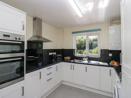 Fridge, electric kettle, toaster, cookware/dishes/utensils