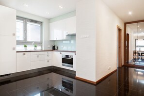 Apartment, 1 Bedroom, Balcony | Private kitchen | Dishwasher, coffee/tea maker, cookware/dishes/utensils - Apartment Jeziorańskiego by Renters (Warsaw)