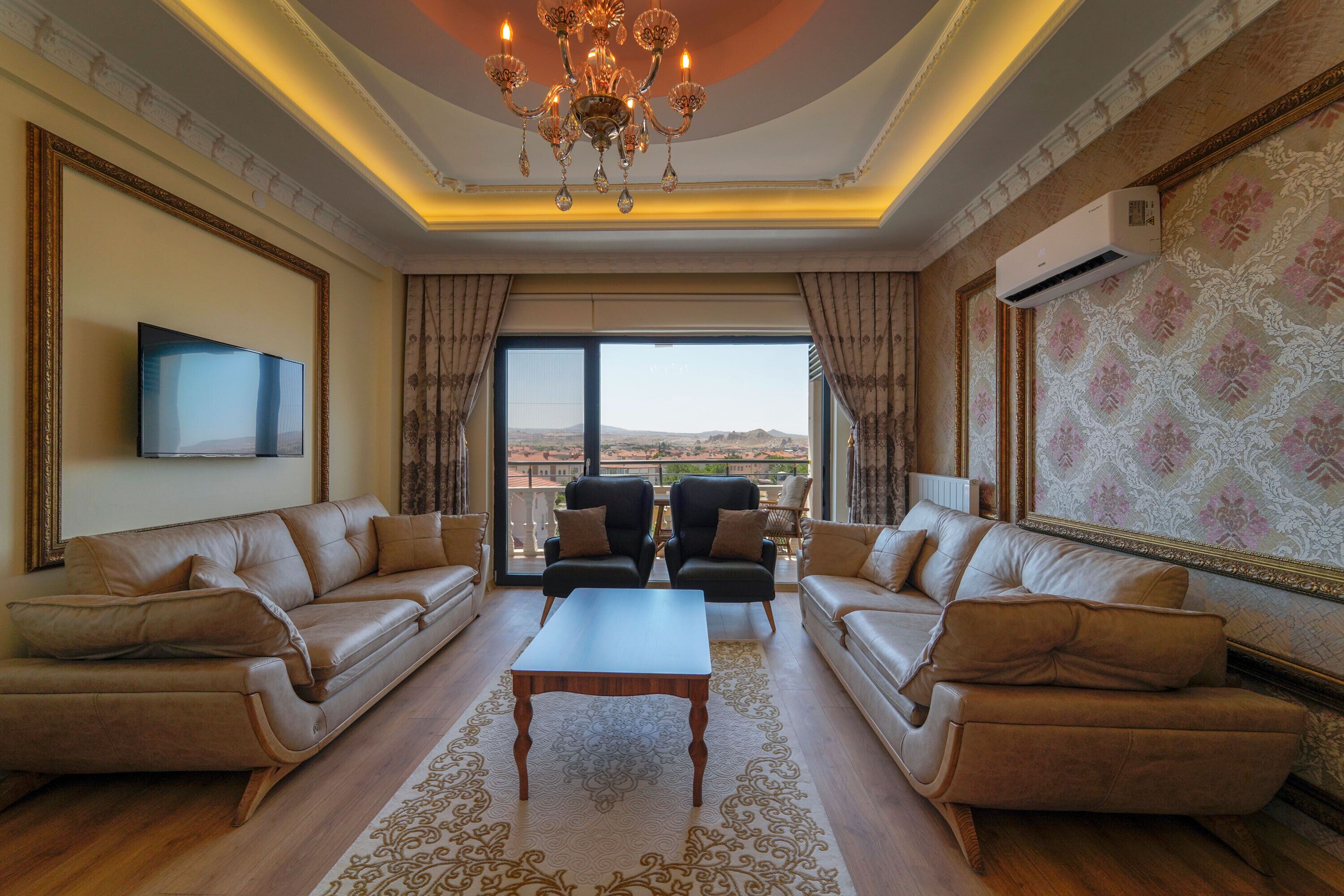 Premium Suite | Living area | 160-inch LED TV with satellite channels, Netflix, first-run movies