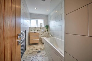 Bathtub, hair dryer, towels