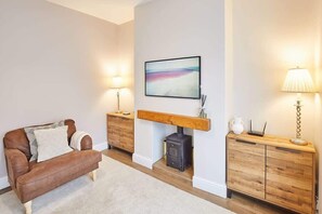 TV, fireplace, books, offices
