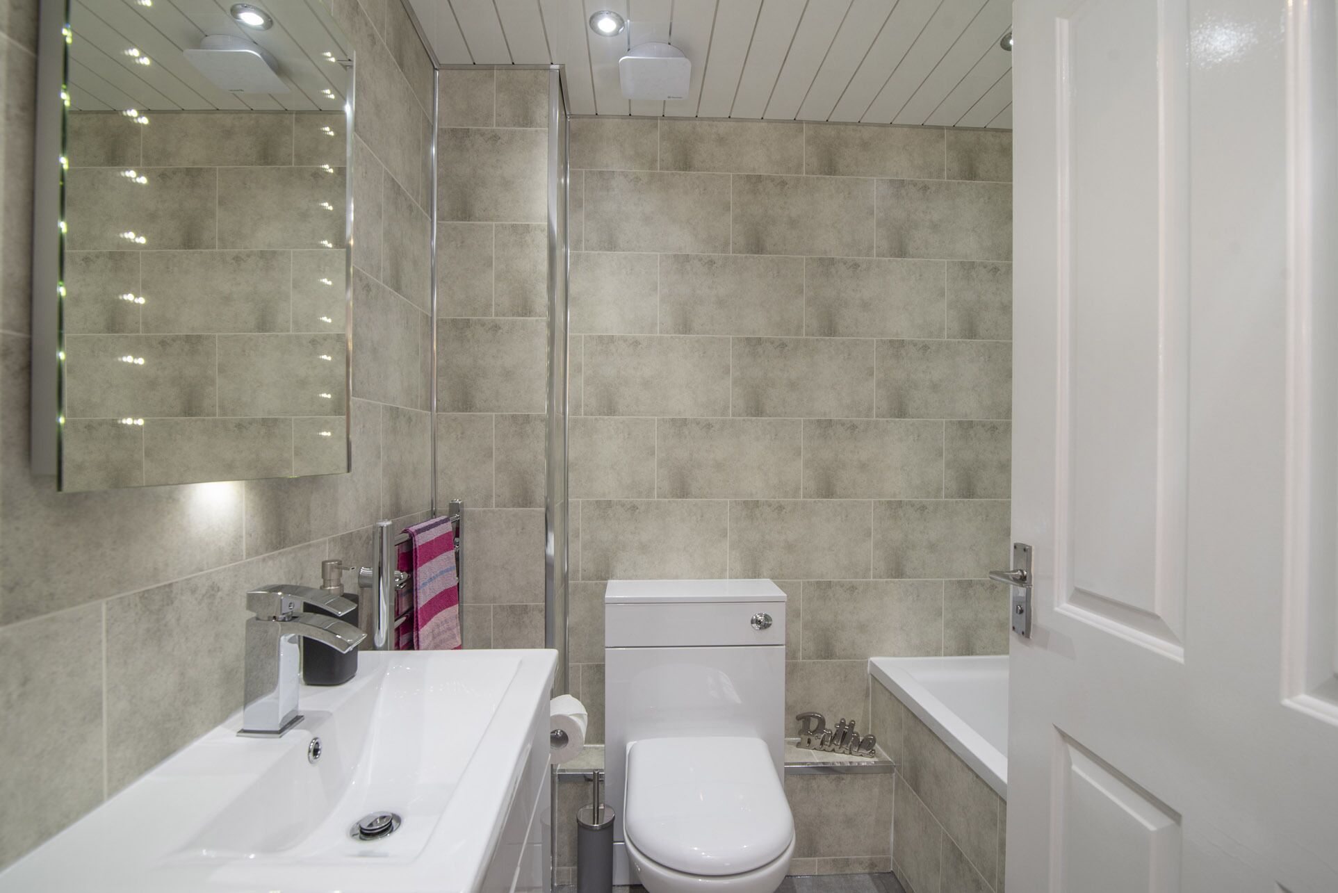 Combined shower/bathtub, hair dryer, towels, soap