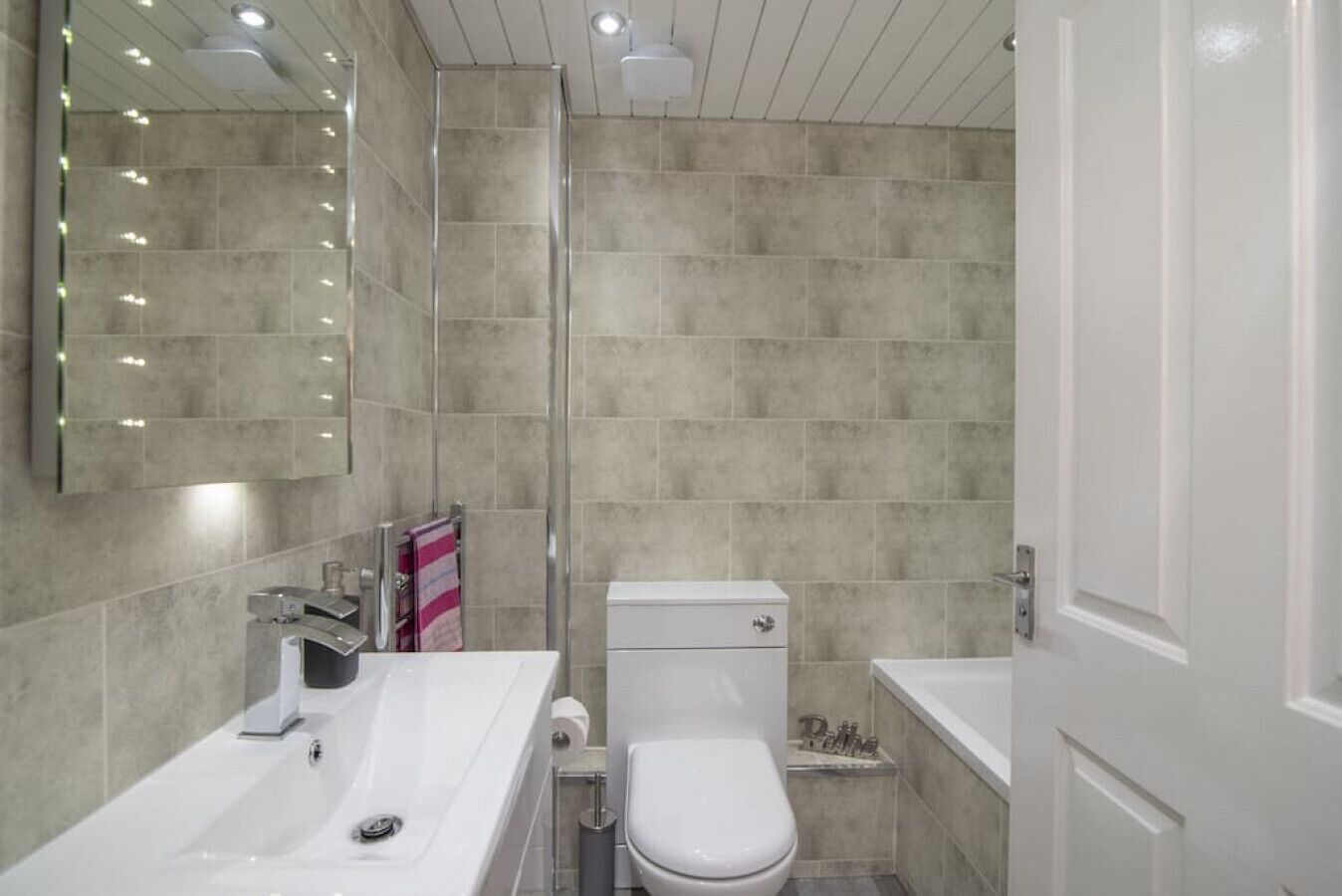 Combined shower/bathtub, hair dryer, towels, soap