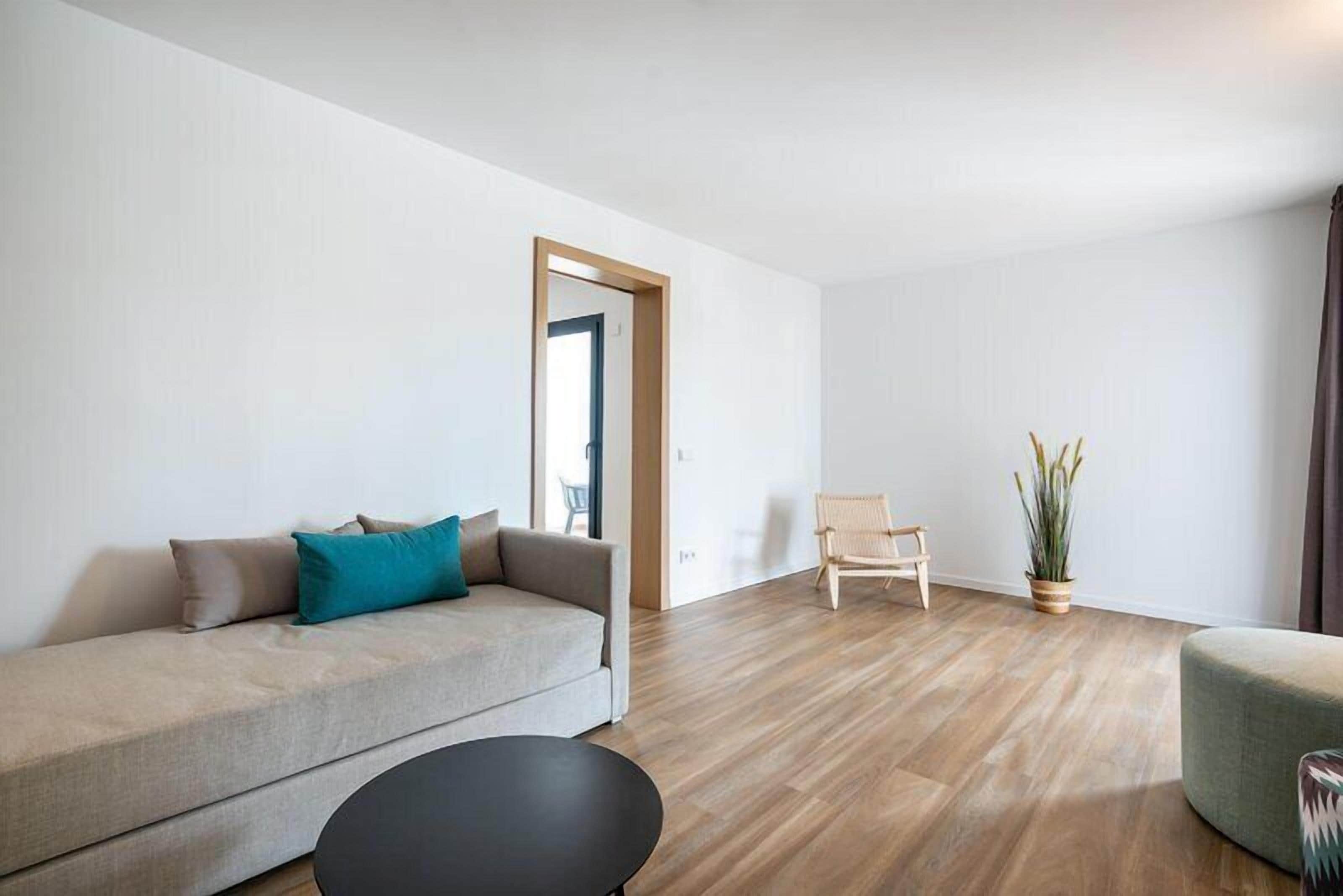 Suite, Balcony | Living area | 50-inch flat-screen TV with satellite channels, TV