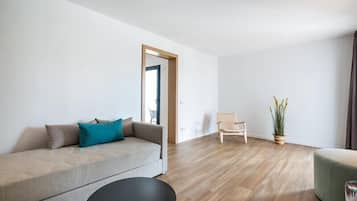 Suite, Balcony | Living area | 50-inch flat-screen TV with satellite channels, TV