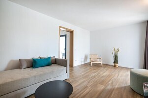 Suite, Balcony | Living area | 50-inch flat-screen TV with satellite channels, TV