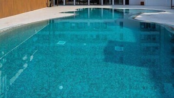 Outdoor pool, open 10:00 AM to 7:00 PM, pool umbrellas, sun loungers
