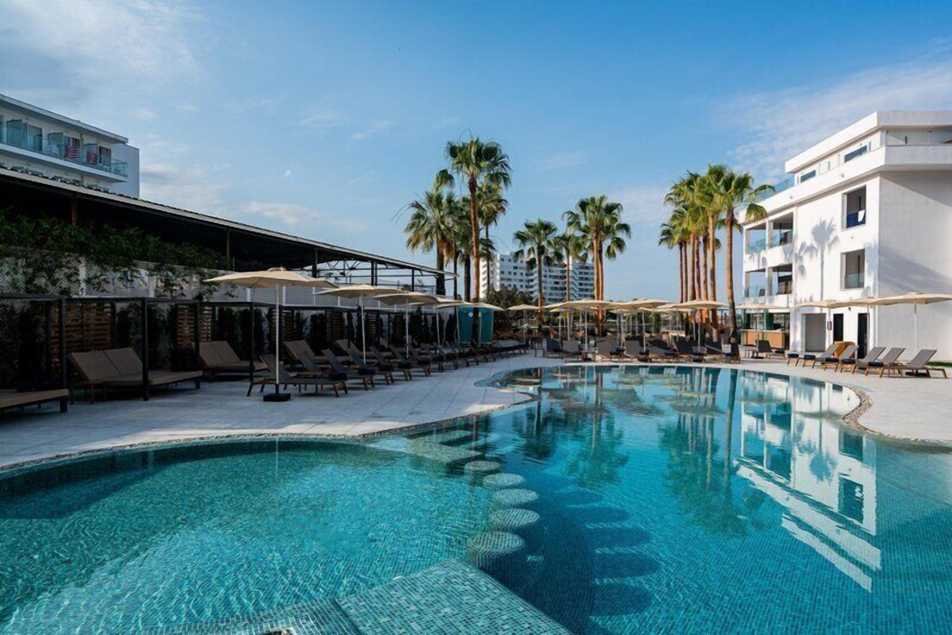 Outdoor pool, open 10:00 AM to 7:00 PM, pool umbrellas, pool loungers