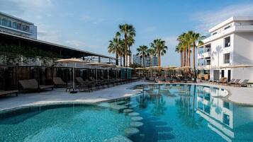 Outdoor pool, open 10:00 AM to 7:00 PM, pool umbrellas, pool loungers