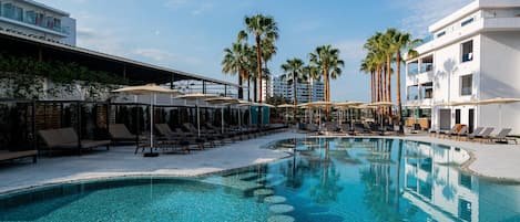 Outdoor pool, open 10:00 AM to 7:00 PM, pool umbrellas, pool loungers