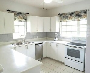 Enjoy cooking in this well-equipped kitchen with dishwasher, double oven, and sink.