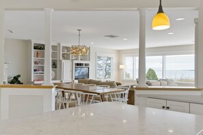 Enjoy meals in the well-lit kitchen with a central island and seating area.