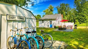 A small building with a sign reading "EVERY SUMMER HAS A STORY".