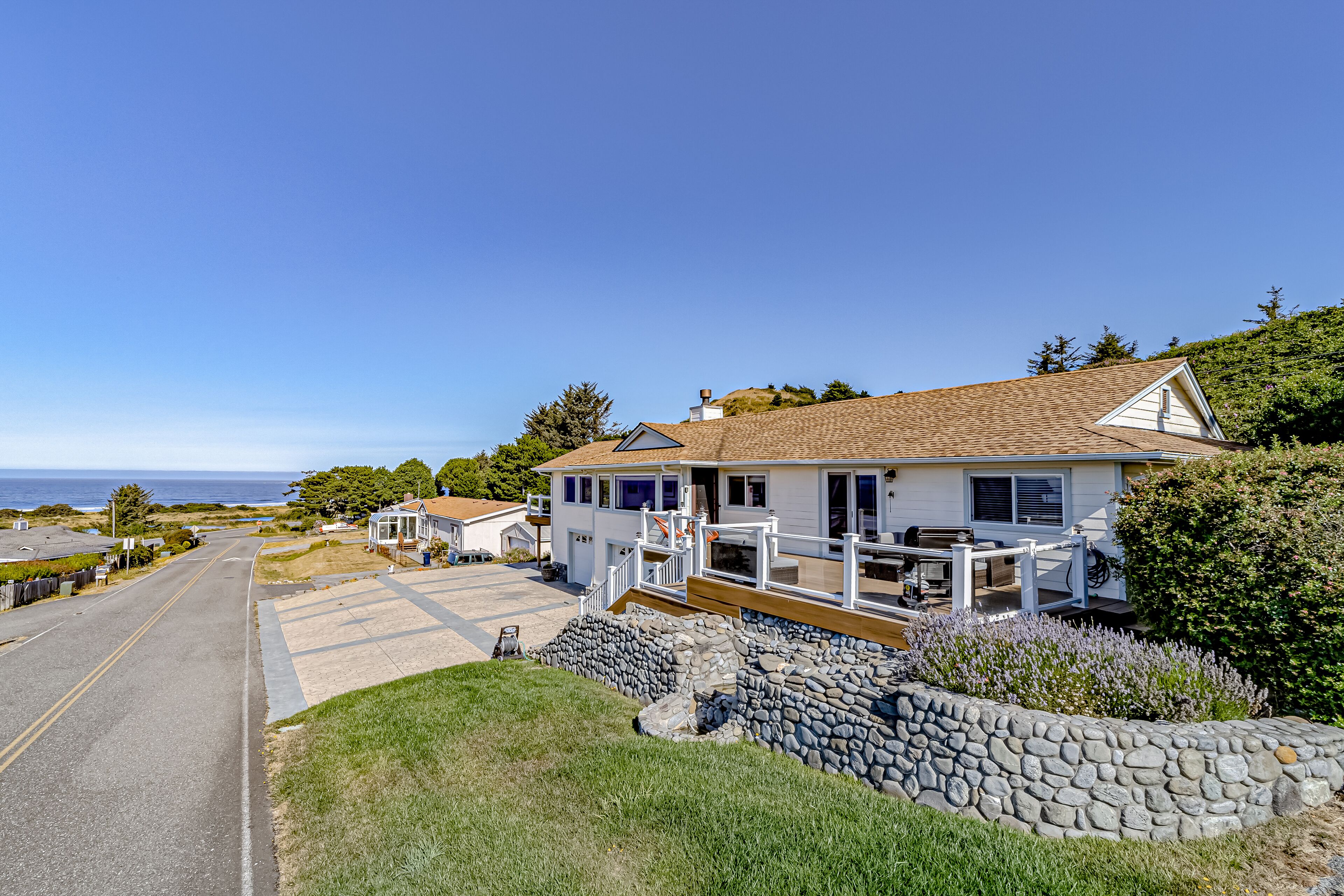 Ocean- & river-view home with EV charger, deck, & central AC - walk to beach