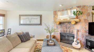 55-inch TV with digital channels, fireplace, streaming services