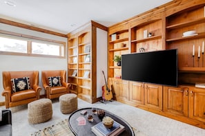 55-inch TV with digital channels, fireplace, streaming services