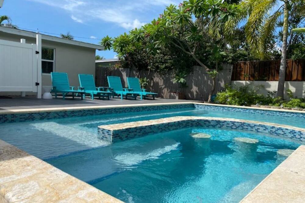 Our "Forever Gem" is a whimsical home with modern flare in Mid-town and minutes from the airport, beaches, parks and other attractions. It features an open floorplan with an updated kitchen designed for entertaining and a separate dining area. <br>We offer 3 bedrooms (king, 2-twins (adjusts to king) and queen) that are arranged and nicely appointed for comfort as well as 2 full bathrooms and on-demand hot water. <br>In the backyard there is a spacious screened in porch off the dining room with 2 rocking chairs and a large private pool and deck chairs to enjoy after a long day exploring Key West! We offer an outdoor shower to rinse off before or after your pool activities. <br>We love the backyard with the salt water outdoor pool especially after a day of bicycling around Key West. It\'s private and relaxing with lush tropical surroundings, expansive outdoor eating area, gas grill, outdoor shower and even ocean breezes!<br>Forever Gem is centrally located in a quiet neighborhood in "mid-town" with easy access Higgs Beach and Smathers Beach as well as one of our favorite restaurants, Salute\' On The Beach! Within minutes you can enjoy all the tourist attractions that Key West has to offer from the Southern Most Point down Duval Street to Mallory Square. Key West Charmer w/Private Swimming Pool