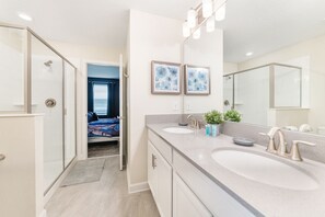 Shower, hair dryer, towels, toilet paper