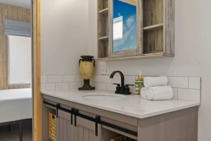 Shower, hair dryer, towels