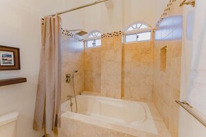 Shower, hair dryer, towels, shampoo