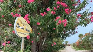 Schild für 'Cidadela Beach Access' in der 137. Straße.